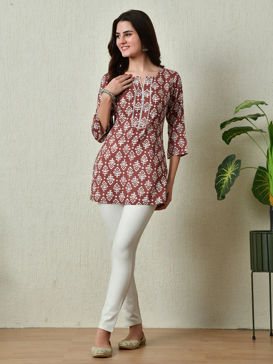 Women Stylish Maroon Cotton Short Kurti With Elegant Print